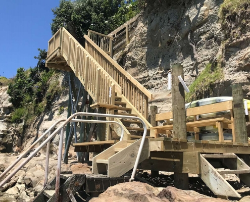 Image of beach staircase overlooking water